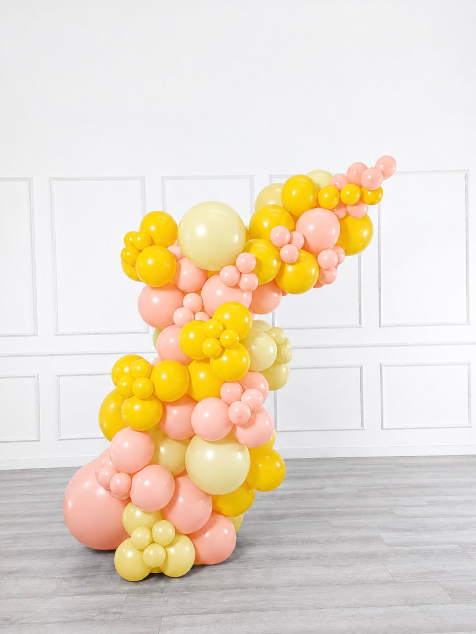 Ana Karina Balloons hello yellow freestanding balloon garland