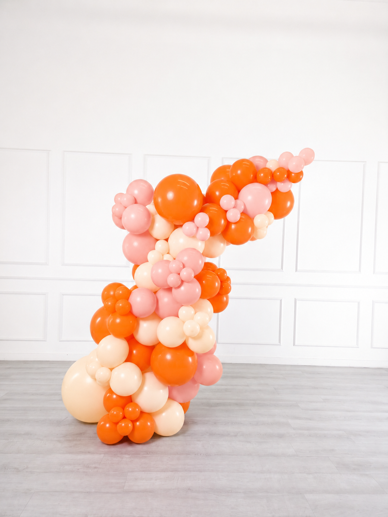 Ana Karina Balloons orange spritz freestanding balloon garland