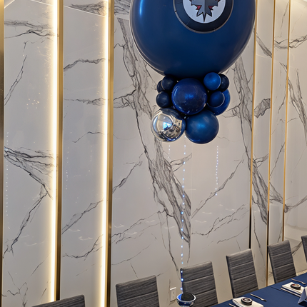 Blue balloon with a logo in a formal dining room setting