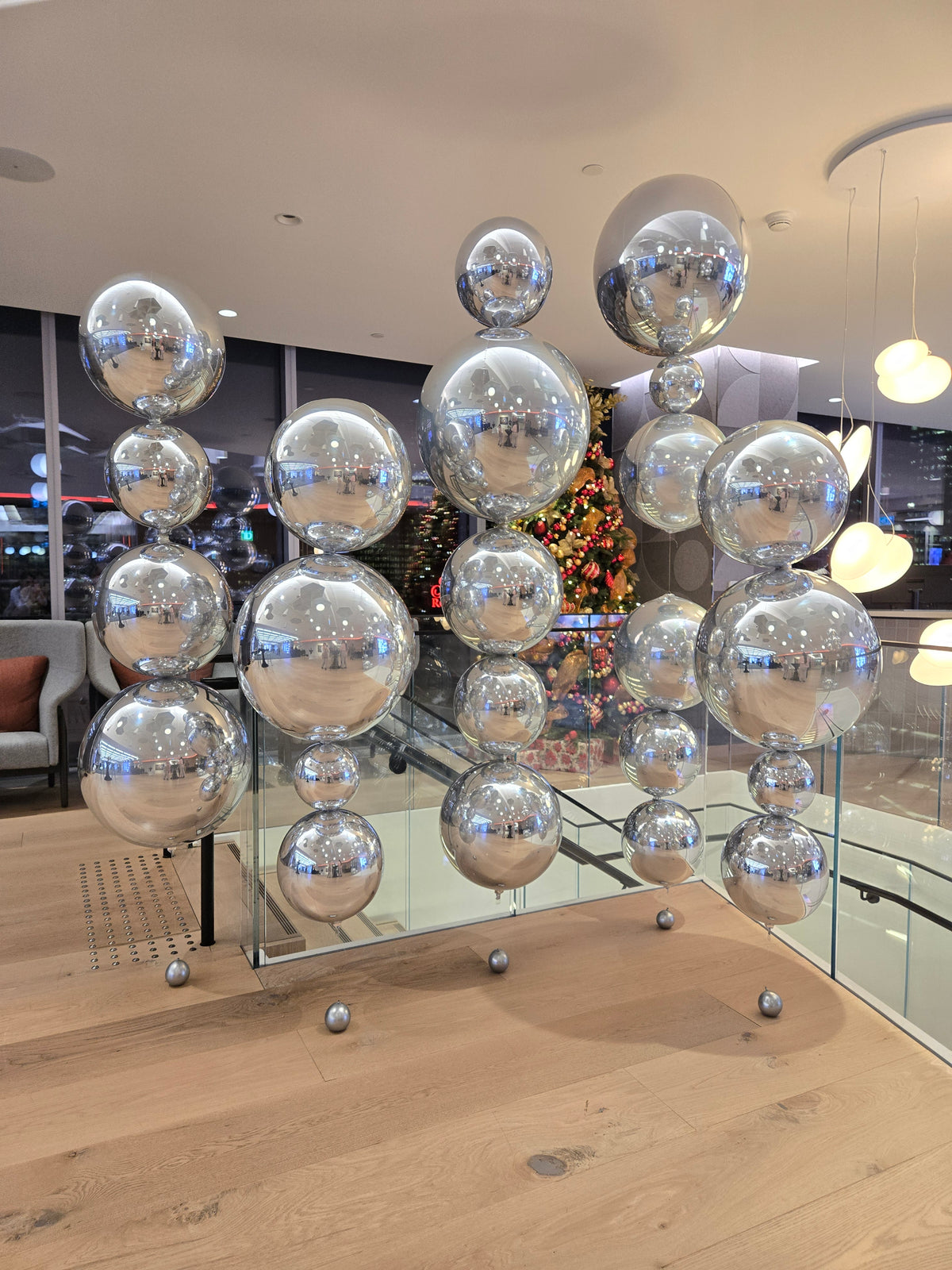 Modern chandelier with silver orbz balloons floating