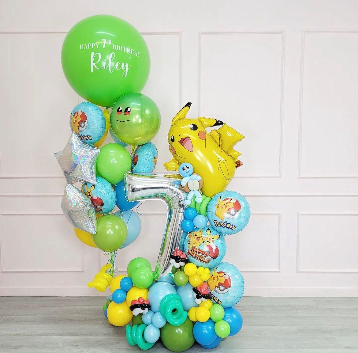A balloon bouquet featuring a variety of colorful balloons with Pokemon characters and thematic elements, including a large base cloud.